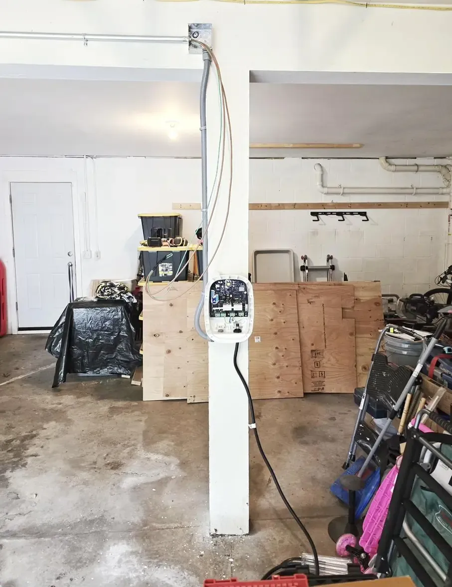 Conduit run from ceiling down post during Emporia EV charger install in Park Forest
