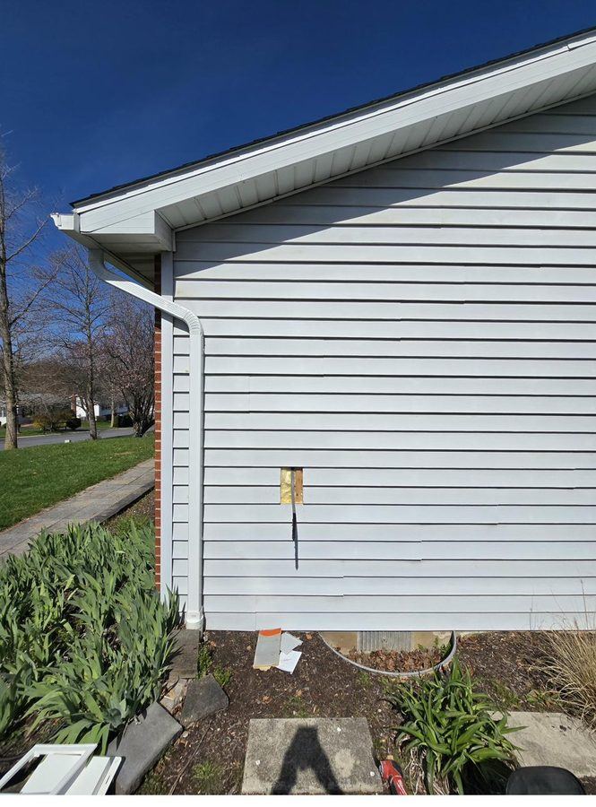 Hole cut in siding during ChargePoint install