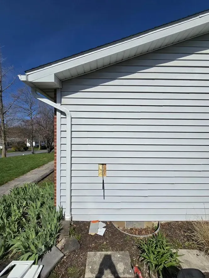 Hole cut in siding during ChargePoint install