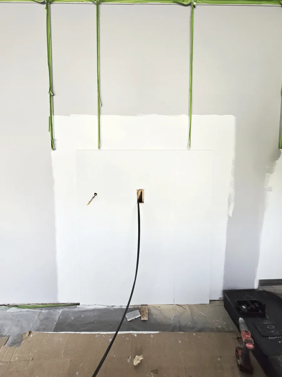 6 AWG copper fished up into the garage stud bay from the basement below, no drywall cut