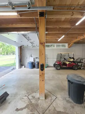 Weatherproof box mounted to the garage beam during the Tesla Wall Connector install in Tyrone · Steel Fox EV & Electric, Central PA