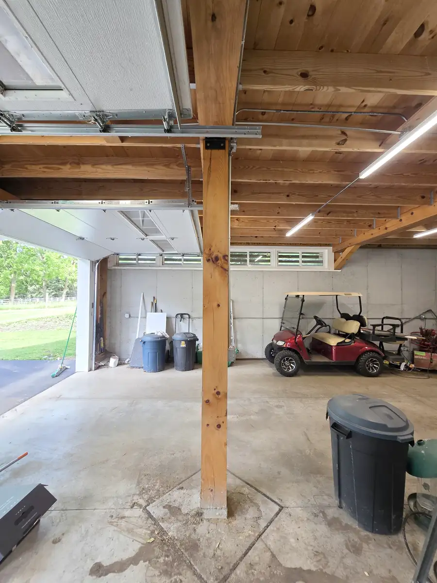 Detached garage in Tyrone before the Tesla Wall Connector install — bare beam over the door